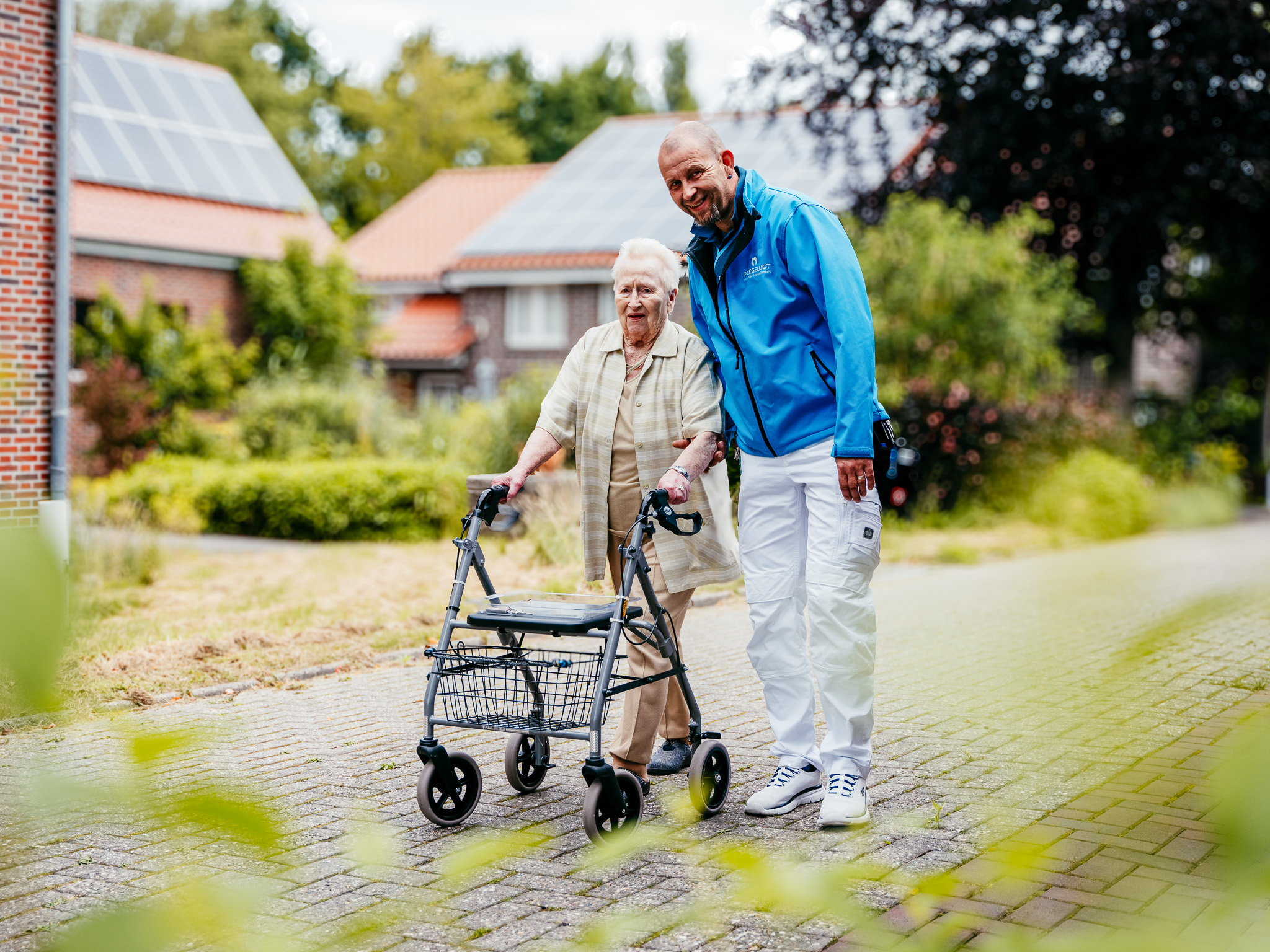 a man and woman with a walker