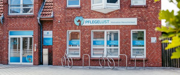 a brick building with a bike rack